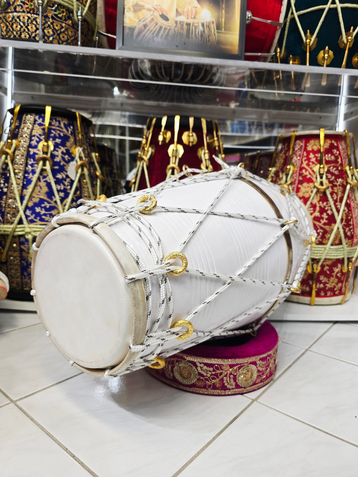 Ivory Current – West Indian Dholak
22.5″ Length | 14.4 lbs Red Sheesham | Exceptional Tone • Minor Cosmetic Blemishes