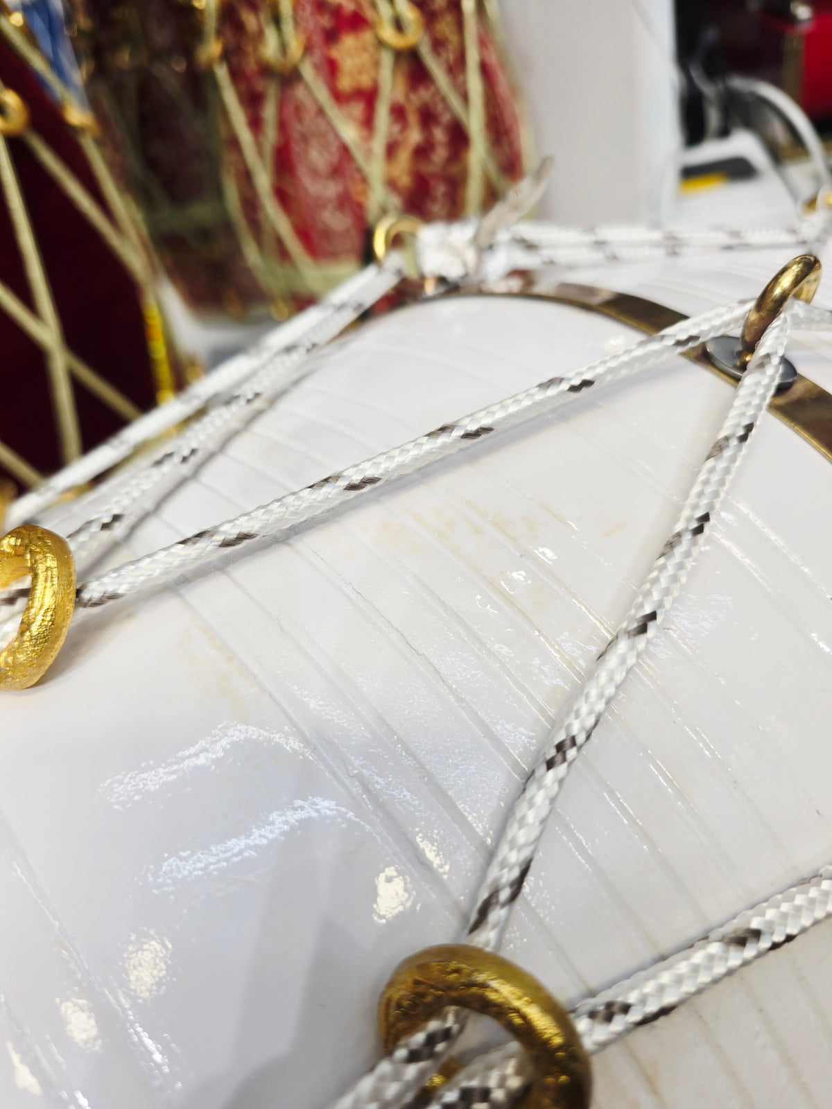 Ivory Current – West Indian Dholak
22.5″ Length | 14.4 lbs Red Sheesham | Exceptional Tone • Minor Cosmetic Blemishes