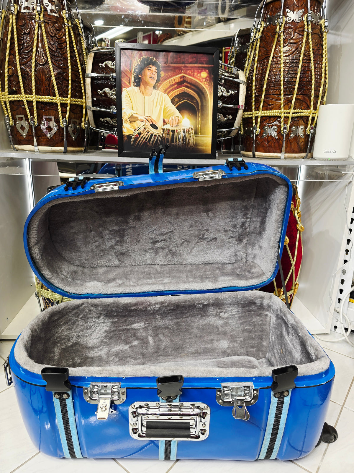 Azura Drift — Glossy Blue Tabla Travel Case · 360° Spinner Wheels · Dual Handles · Fixed Reinforcement Bands · Minor Cosmetic Blemishes (g)