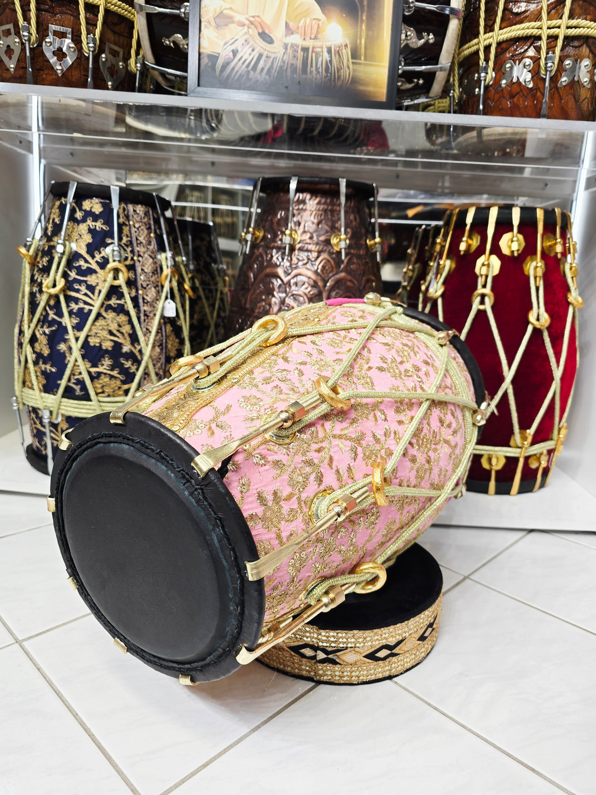 Gulzar Rosé — Pink Sherwani-Wrapped Red Sheesham Dholak · Black Skins · Gold Roping