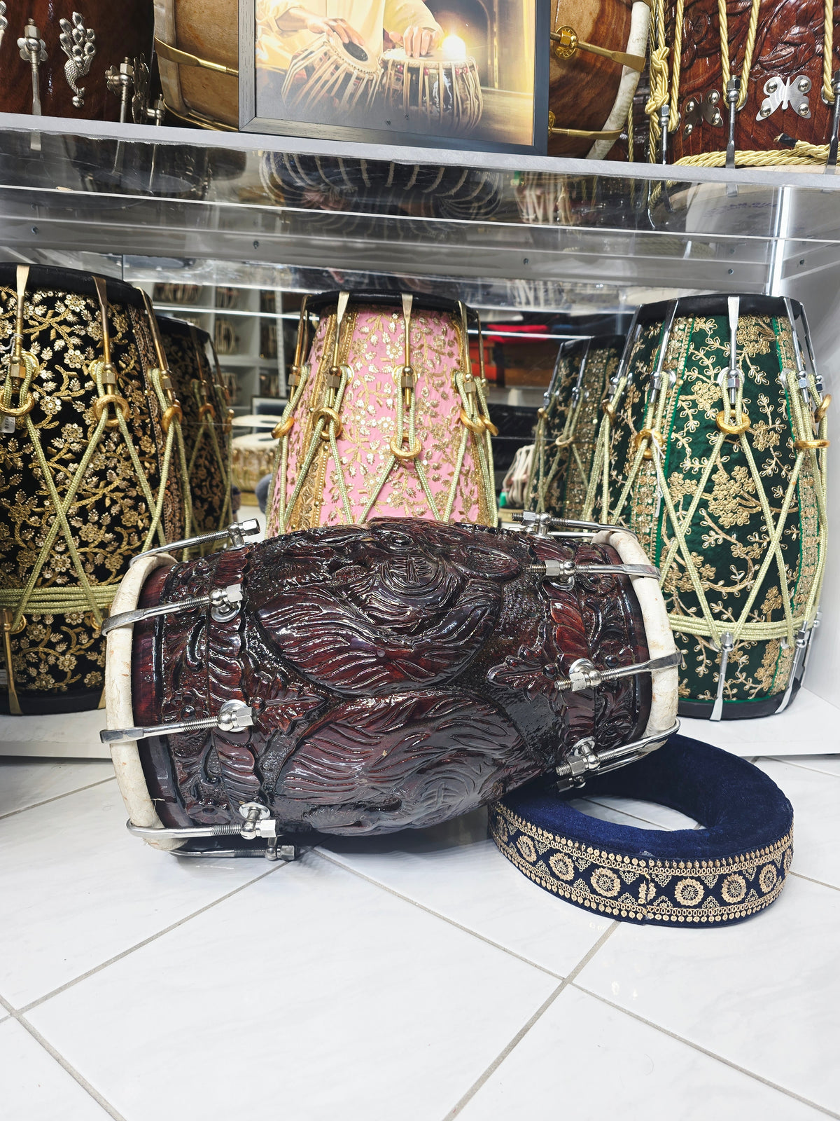 Rajshree Heritage Black Sheesham Dholak by Maa Ambika | Intricately Hand Carved Glossy Shell with Green Undercoating with Mehendi Designed Skins