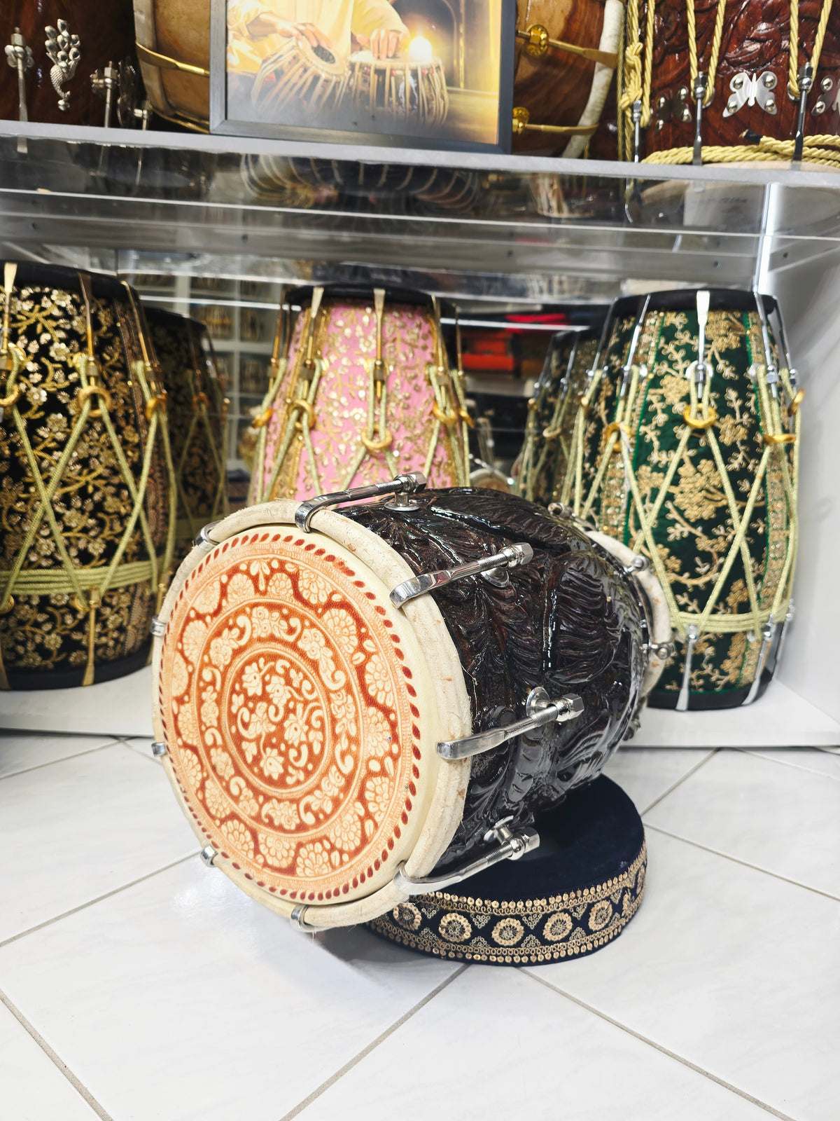 Rajshree Heritage Black Sheesham Dholak by Maa Ambika | Intricately Hand Carved Glossy Shell with Green Undercoating with Mehendi Designed Skins