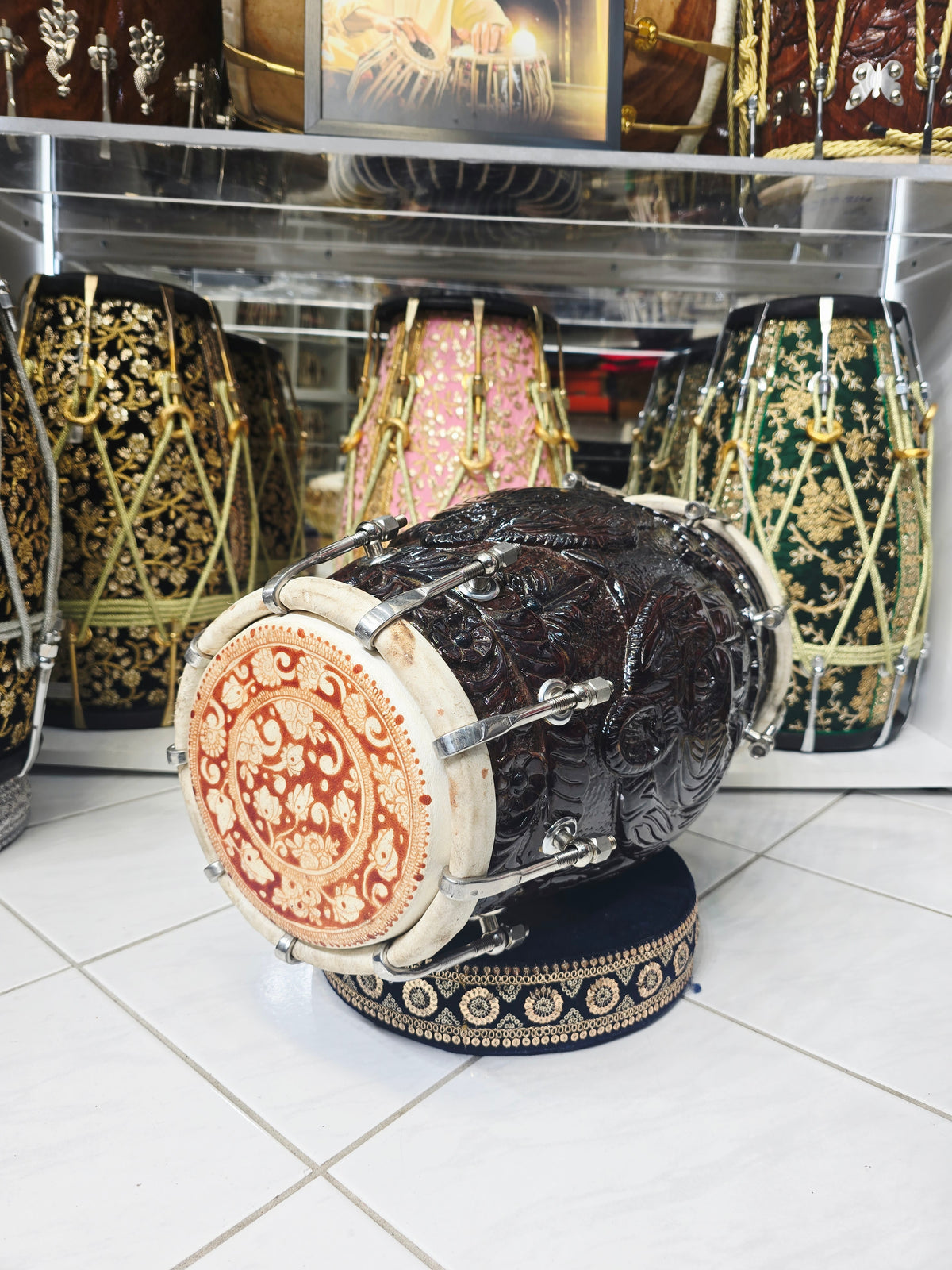 Rajshree Heritage Black Sheesham Dholak by Maa Ambika | Intricately Hand Carved Glossy Shell with Green Undercoating with Mehendi Designed Skins