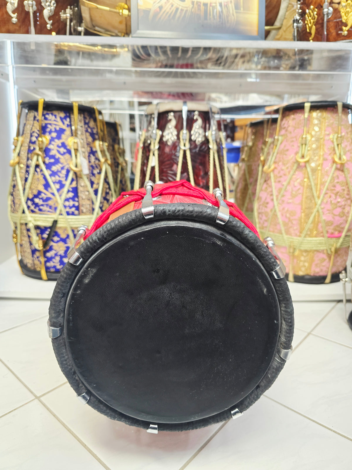 Laal Darbar – Premium Red Designer Leather Wrapped Red Sheesham Dholak | Red Cosmetic Ropes & Black Skins *Minor Cosmetic Blemish/ Tear *Exceptional Tone