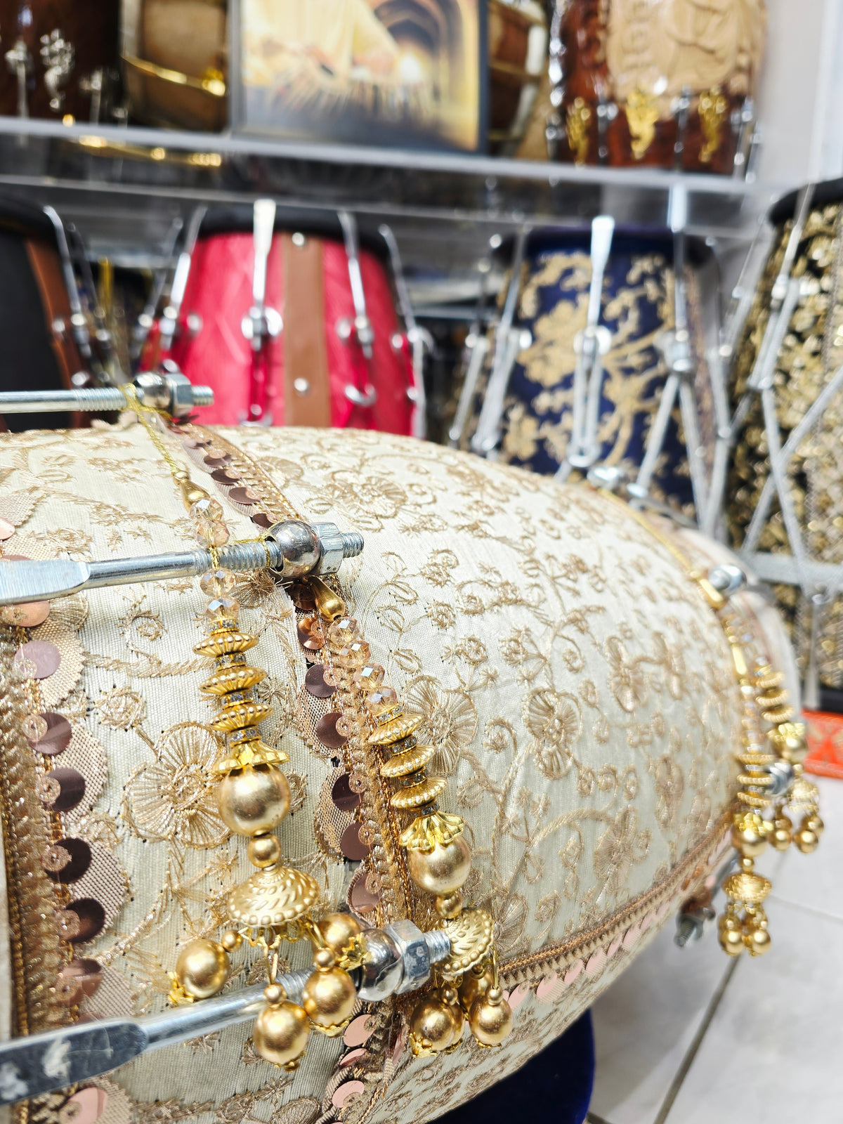 Noor-e-Mehfil – Ivory & Gold Floral Sherwani-Wrapped Designer Mehendi Night Dholak with Decorative Golden Ornaments
