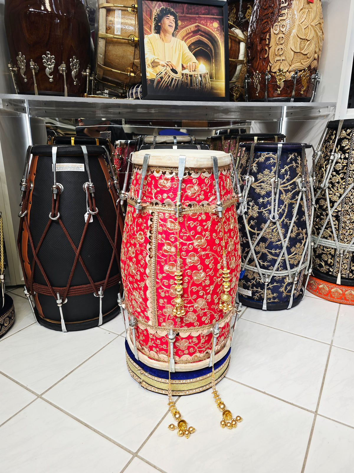 Rang Mahal – Royal Scarlet & Gold Floral Sherwani-Wrapped Designer Mehendi Night Dholak with Decorative Golden Ornaments