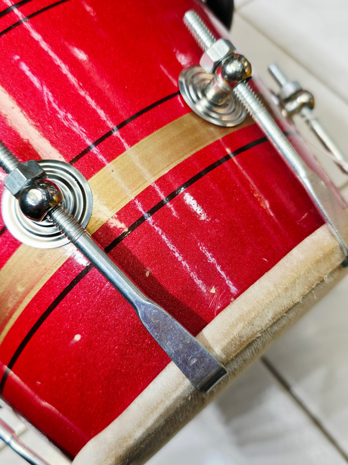 Agni Rekha – Metallic Ruby Red & Champagne Gold Striped Student Dholak with Black Pinstripes & Carrying Handle *Very Minor Cosmetic Blemishes (R3)