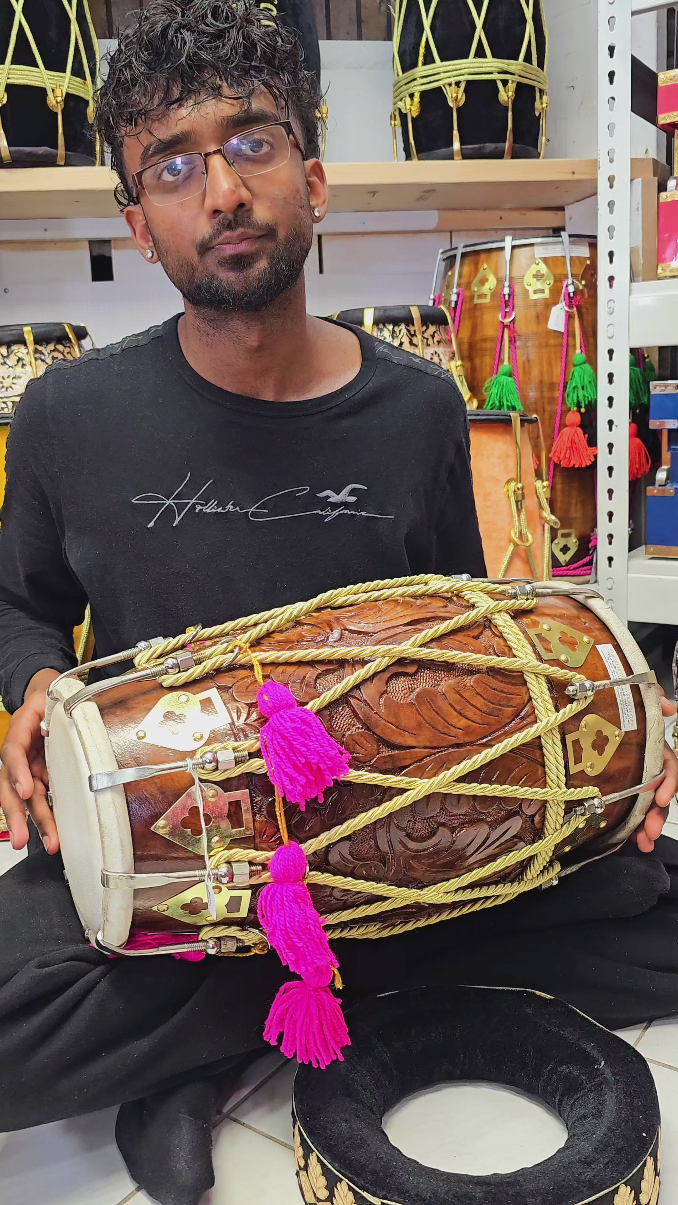 Melodic Opulence: Encarved Red Sheesham Dholak with Golden Ropes Design, Pink Tassels, and Chrome Bolts (BLACK FRIDAY SALE!)