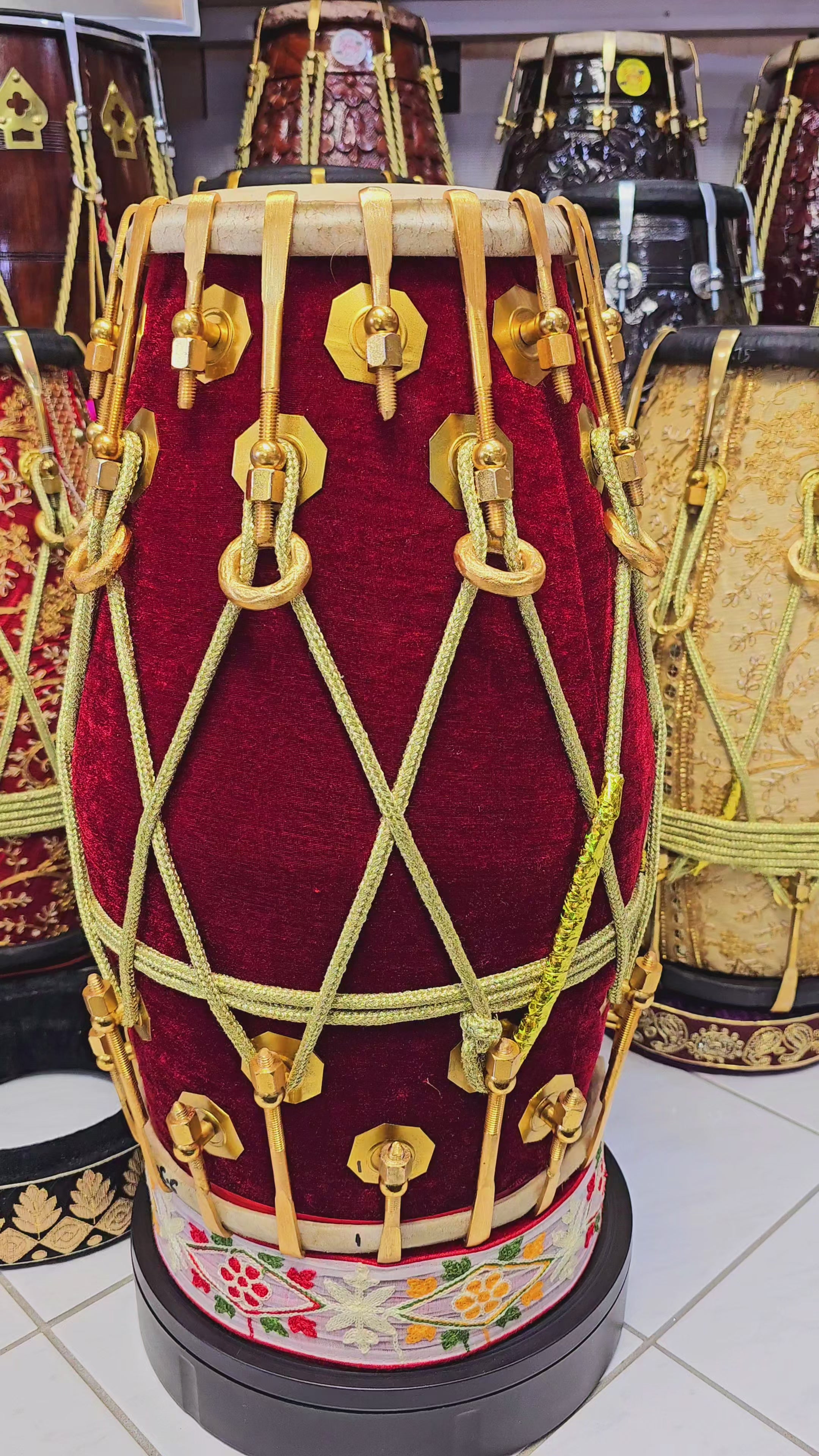 Regal Resonance: 36-Bolted Red Velvet Wrapped Red Sheesham Dholak with Golden Pure Brass Bolts and Ropes Design